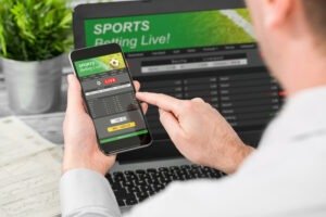 Betting,Bet,Sport,Phone,Gamble,Laptop,Over,Shoulder,Soccer,Live